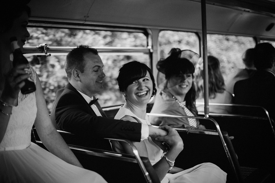 The bride wears Charlie Brear for her 'Railway Children' inspired yellow wedding. Photography by Claudia Rose Carter.