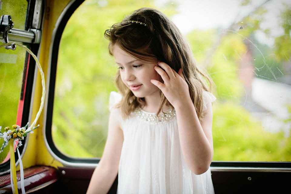 The bride wears Charlie Brear for her 'Railway Children' inspired yellow wedding. Photography by Claudia Rose Carter.