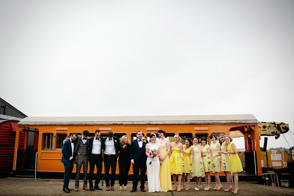 The bride wears Charlie Brear for her 'Railway Children' inspired yellow wedding. Photography by Claudia Rose Carter.