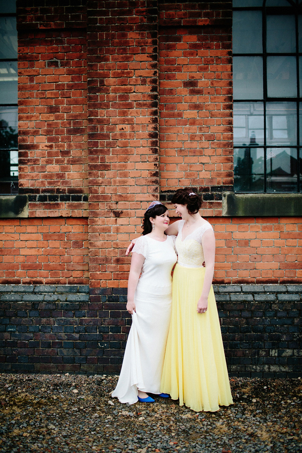 The bride wears Charlie Brear for her 'Railway Children' inspired yellow wedding. Photography by Claudia Rose Carter.