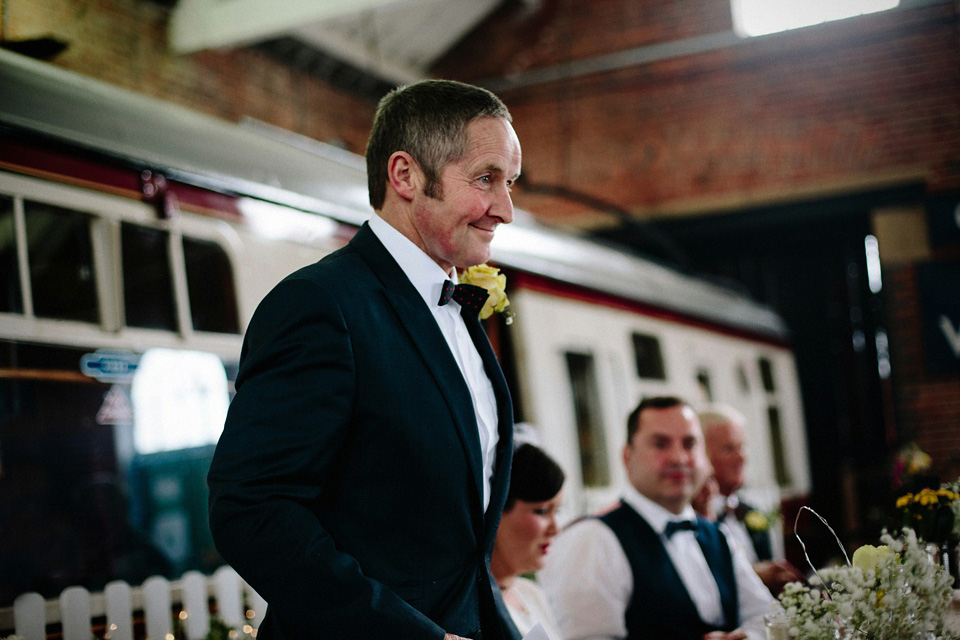 The bride wears Charlie Brear for her 'Railway Children' inspired yellow wedding. Photography by Claudia Rose Carter.