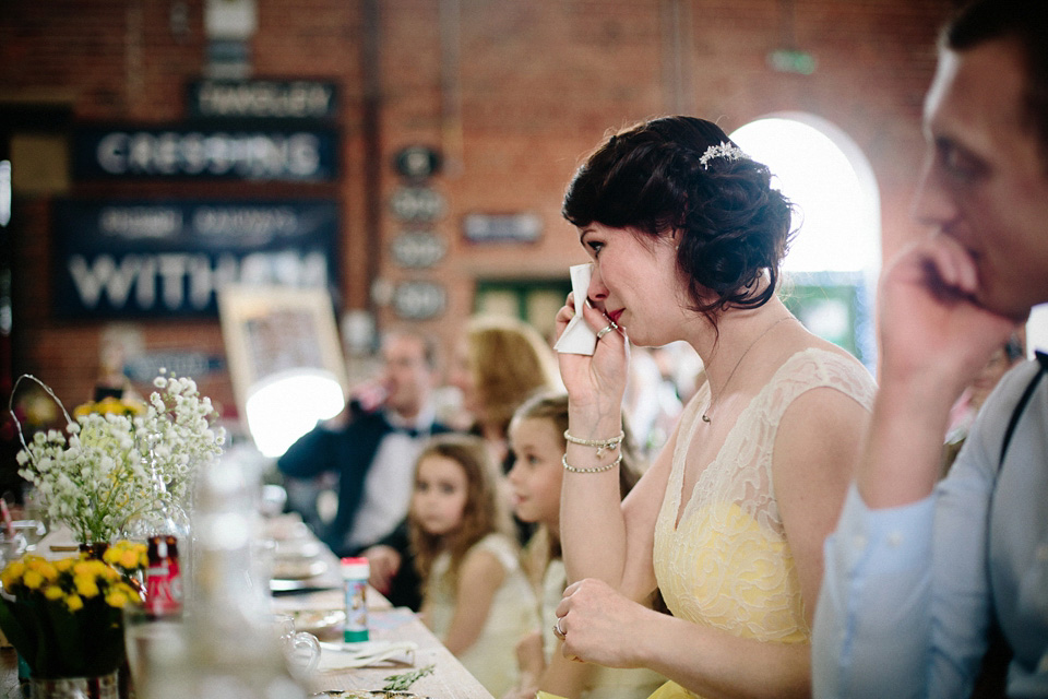 The bride wears Charlie Brear for her 'Railway Children' inspired yellow wedding. Photography by Claudia Rose Carter.