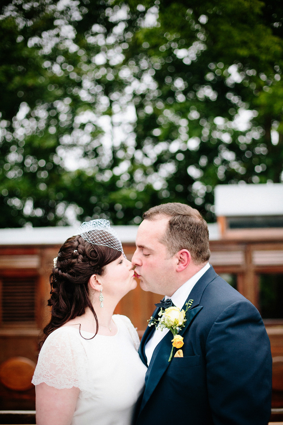 The bride wears Charlie Brear for her 'Railway Children' inspired yellow wedding. Photography by Claudia Rose Carter.