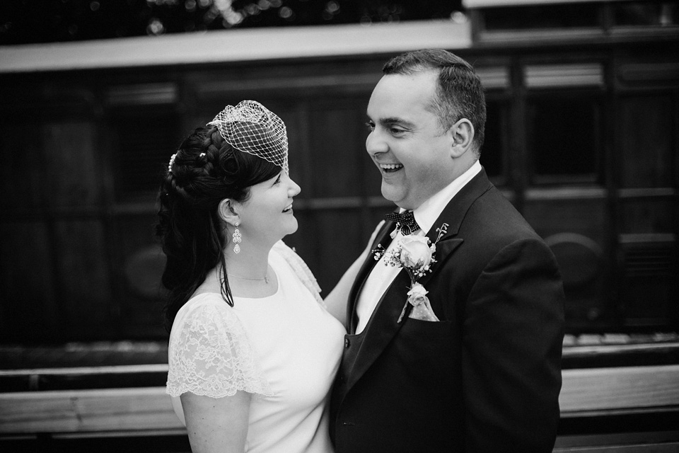 The bride wears Charlie Brear for her 'Railway Children' inspired yellow wedding. Photography by Claudia Rose Carter.