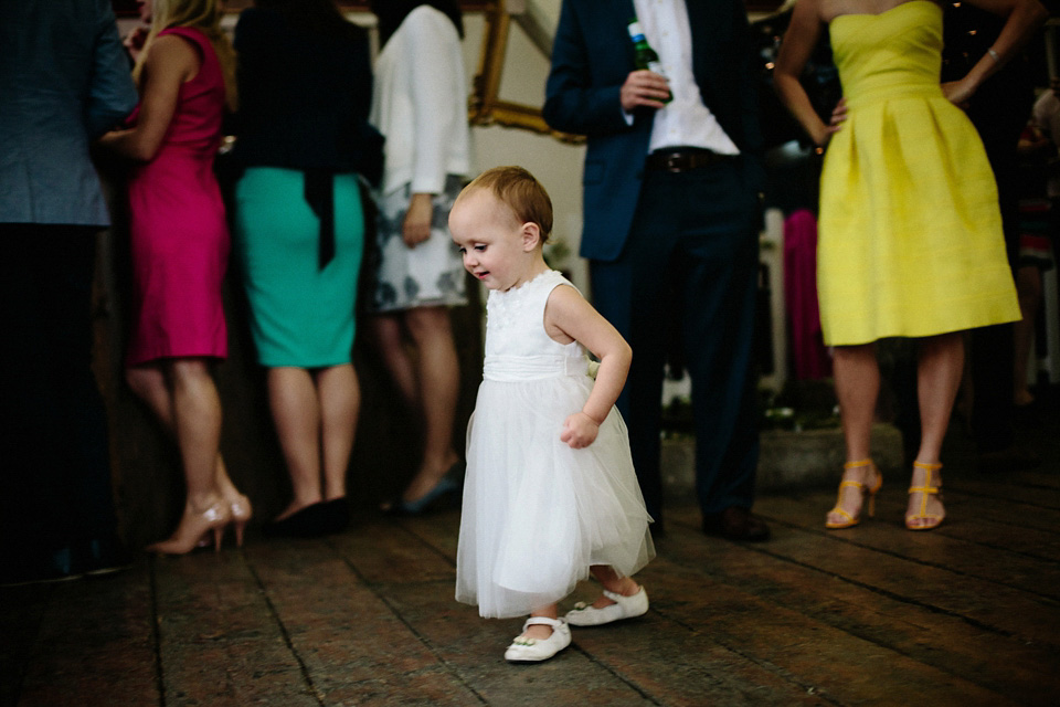 The bride wears Charlie Brear for her 'Railway Children' inspired yellow wedding. Photography by Claudia Rose Carter.