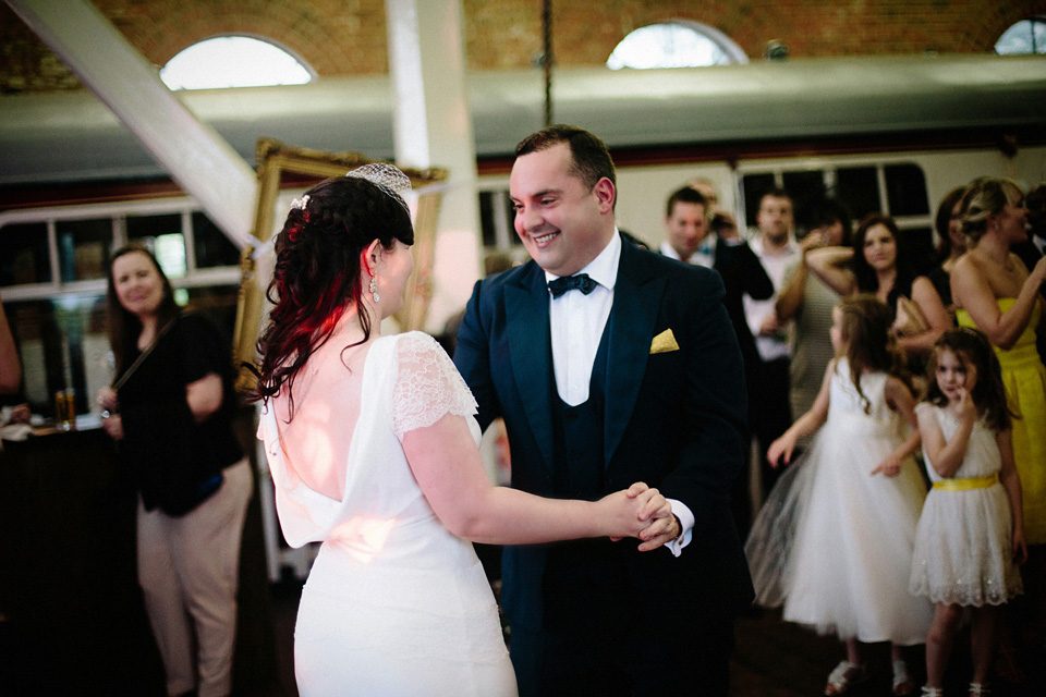 The bride wears Charlie Brear for her 'Railway Children' inspired yellow wedding. Photography by Claudia Rose Carter.