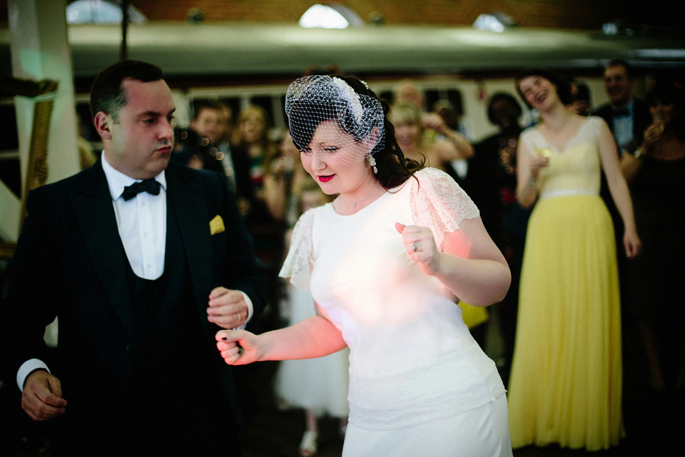 The bride wears Charlie Brear for her 'Railway Children' inspired yellow wedding. Photography by Claudia Rose Carter.