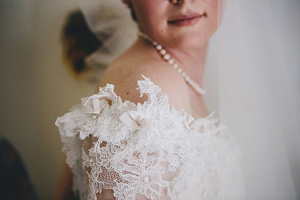 The bride wears 'Sophia' by Ian Stuart for her sweet, local, intimate and vintage inspired village wedding. Photography by The Twins.