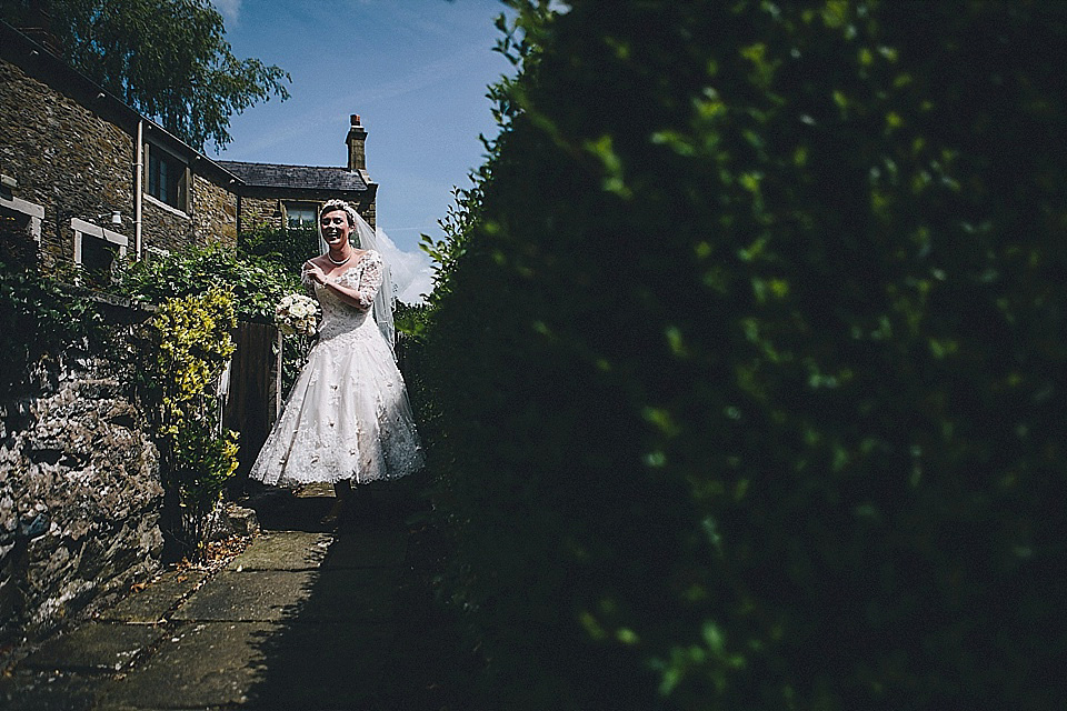 The bride wears 'Sophia' by Ian Stuart for her sweet, local, intimate and vintage inspired village wedding. Photography by The Twins.