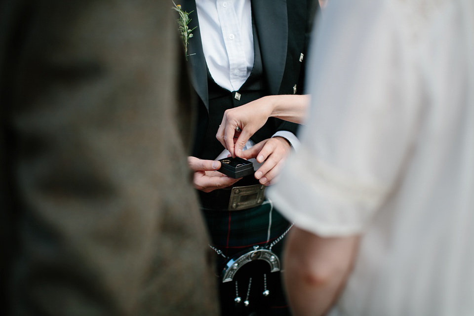 A Humanist handfasting outdoor ceremony at The Secret Herb Garden, just outside Edinburgh. The bride wore 'Minna'. Photography by Caro Weiss.