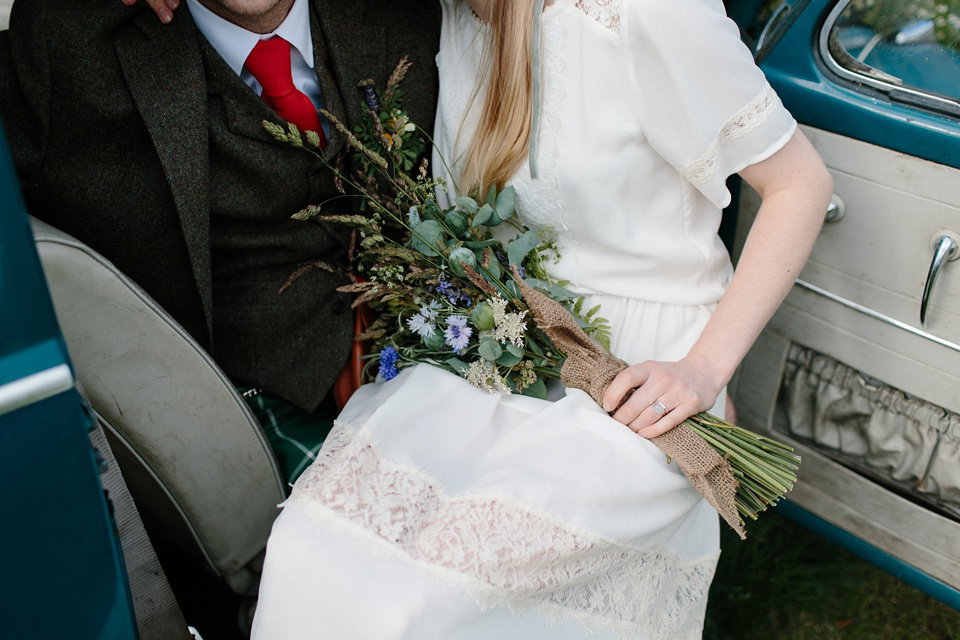 A Humanist handfasting outdoor ceremony at The Secret Herb Garden, just outside Edinburgh. The bride wore 'Minna'. Photography by Caro Weiss.