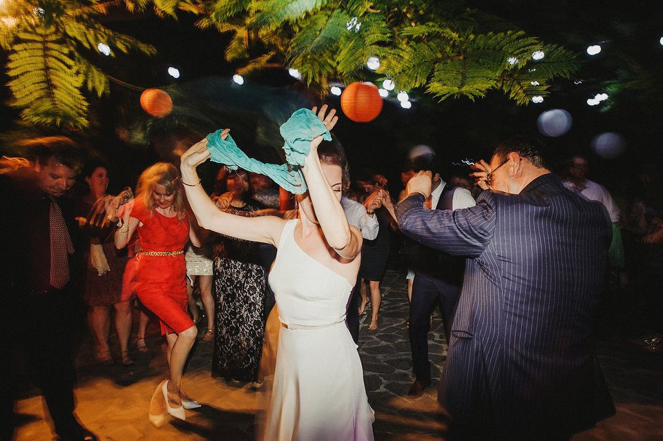 A sophisticated asymmetric dress and sweet first look for a colourful outdoor wedding in Spain. Photography by This Modern Love.