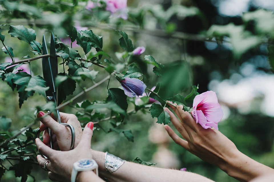 A sophisticated asymmetric dress and sweet first look for a colourful outdoor wedding in Spain. Photography by This Modern Love.