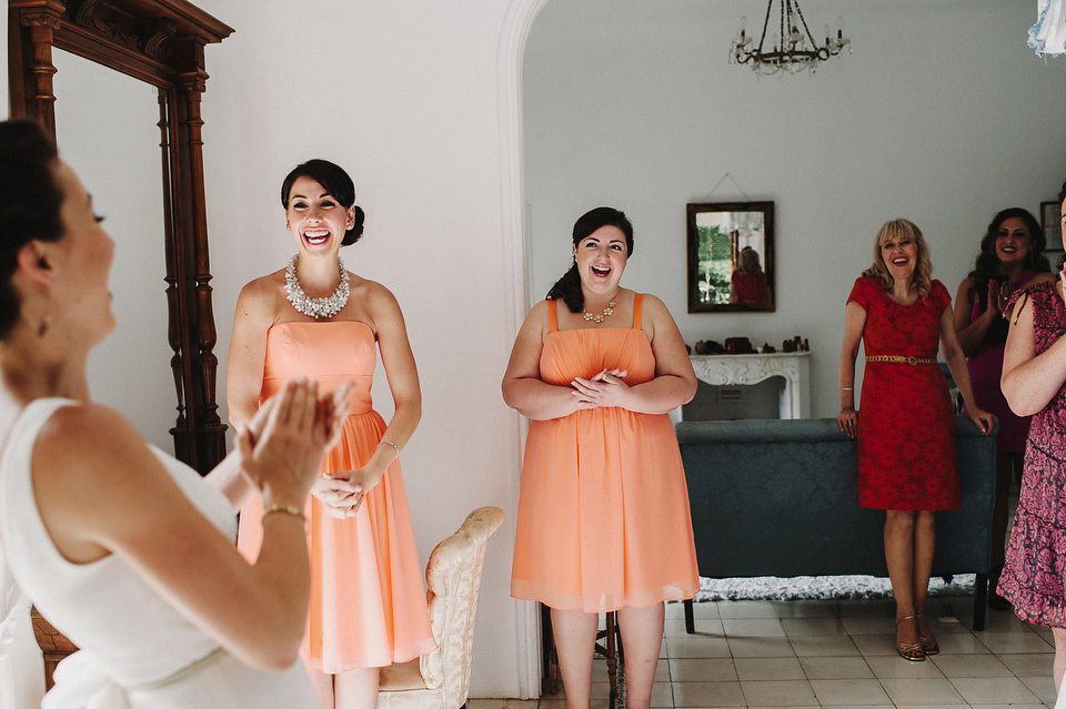 A sophisticated asymmetric dress and sweet first look for a colourful outdoor wedding in Spain. Photography by This Modern Love.