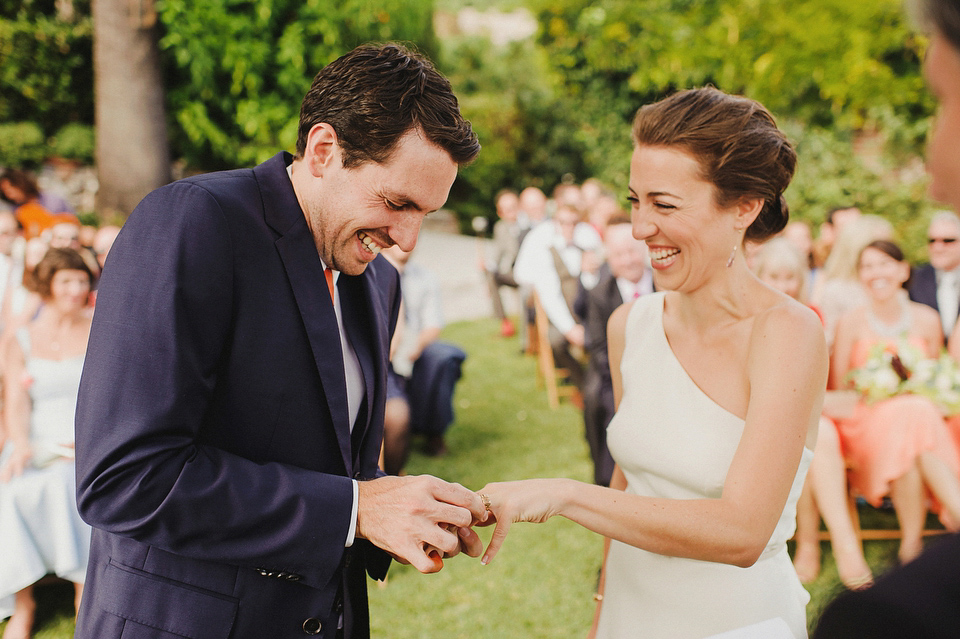 A sophisticated asymmetric dress and sweet first look for a colourful outdoor wedding in Spain. Photography by This Modern Love.