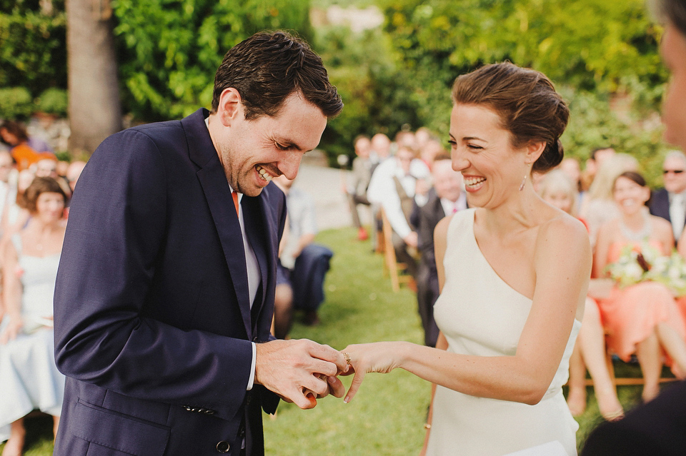 A sophisticated asymmetric dress and sweet first look for a colourful outdoor wedding in Spain. Photography by This Modern Love.