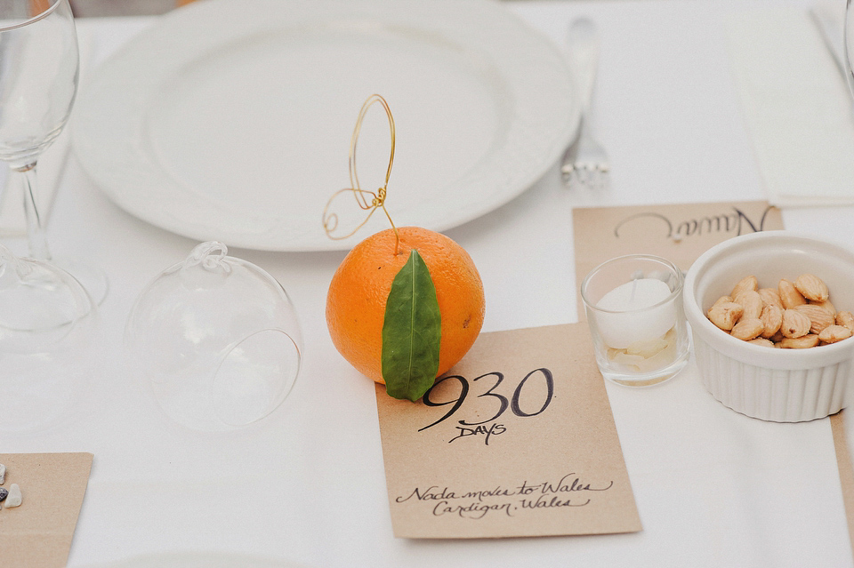 A sophisticated asymmetric dress and sweet first look for a colourful outdoor wedding in Spain. Photography by This Modern Love.