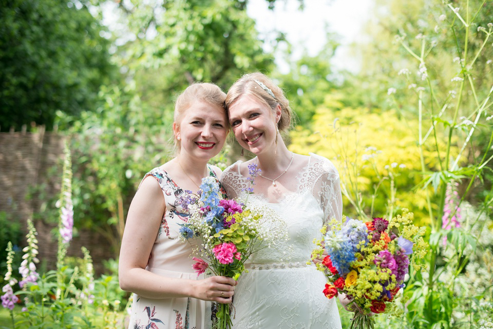 The bride wears Katya Katya Shehurina for her colourful country garden wedding. Photography by Kayleigh Pope.