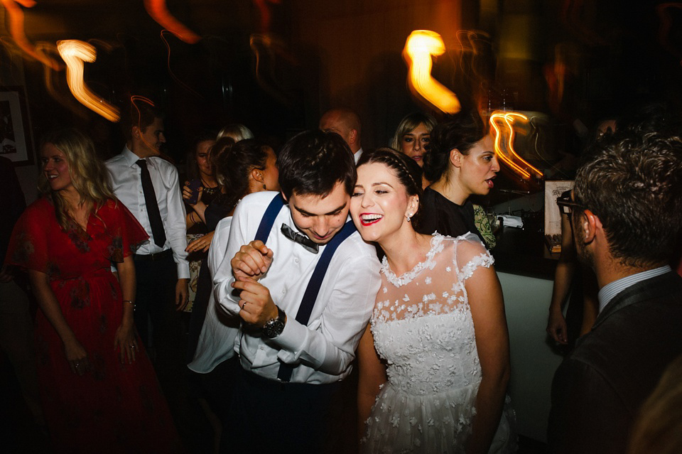 An elegant wedding in Croatia with a bride wearing a dress covered in silk petals and a pug dog in a red bow tie. Photography by Marko Marinkovic.