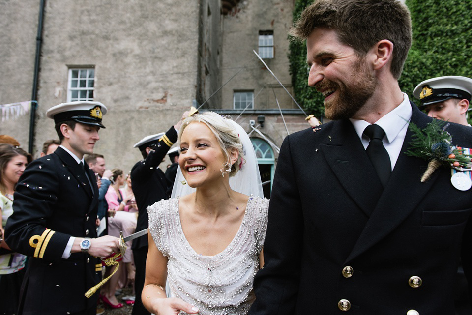 An Anna Campbell Gown, Kilts and Military Regalia for a Humanist Scottish Castle Wedding. Photography by Nikki Leadbetter.