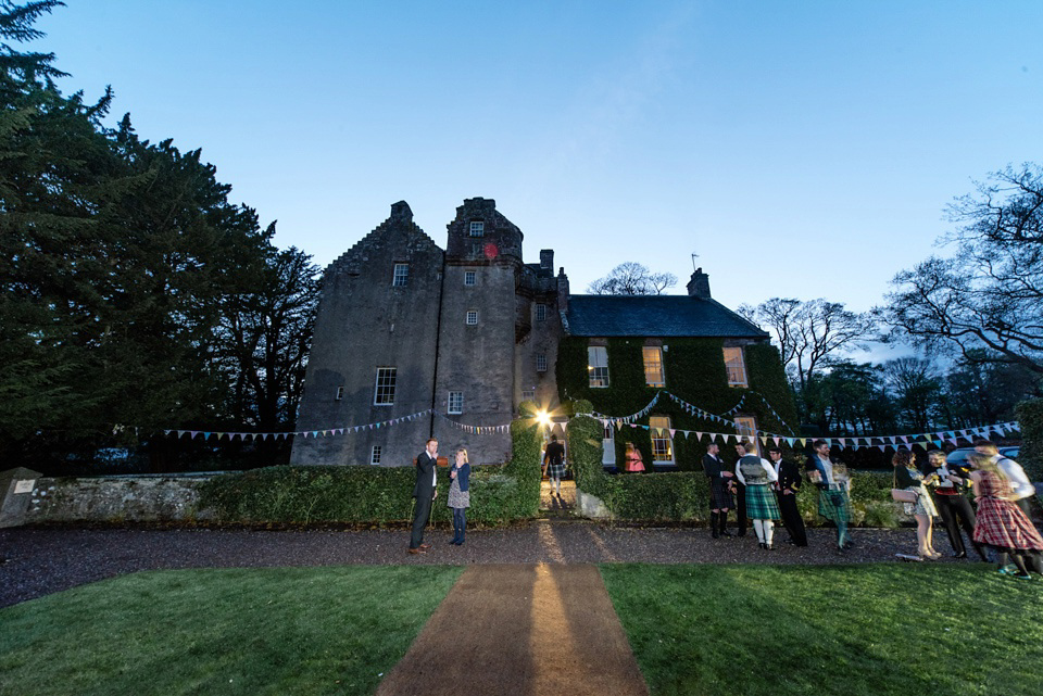 An Anna Campbell Gown, Kilts and Military Regalia for a Humanist Scottish Castle Wedding. Photography by Nikki Leadbetter.