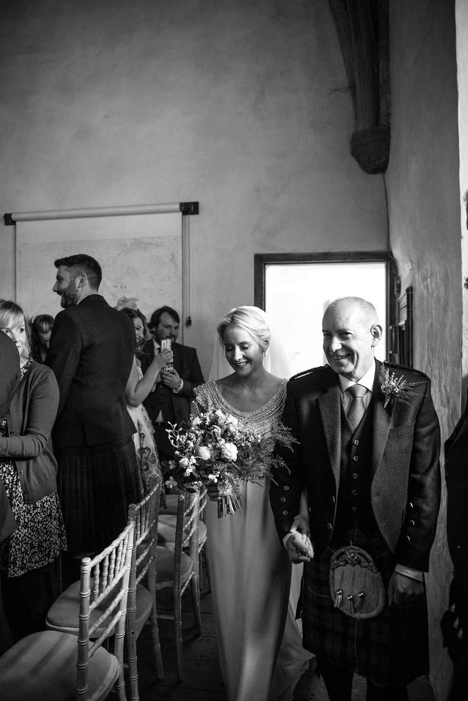 An Anna Campbell Gown, Kilts and Military Regalia for a Humanist Scottish Castle Wedding. Photography by Nikki Leadbetter.