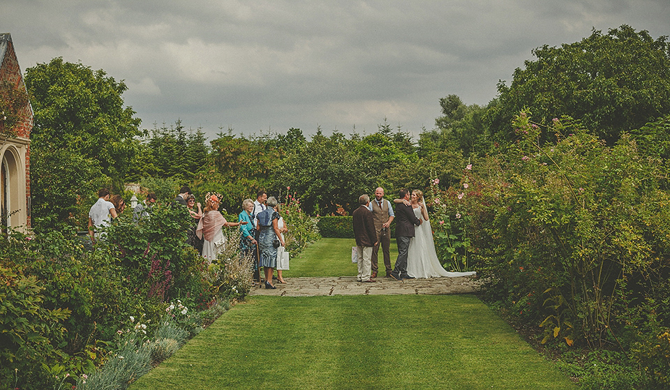 The bride wears an elegant Stephanie Allin gown for her wedding at Childerley in Cambridge. Photography by Howell Jones.