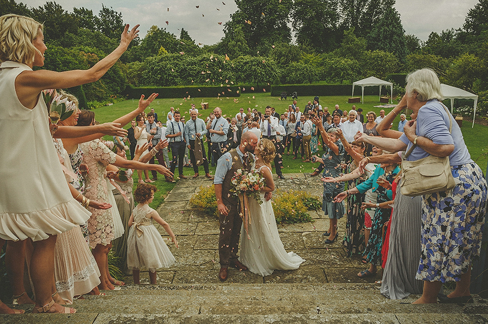 The bride wears an elegant Stephanie Allin gown for her wedding at Childerley in Cambridge. Photography by Howell Jones.