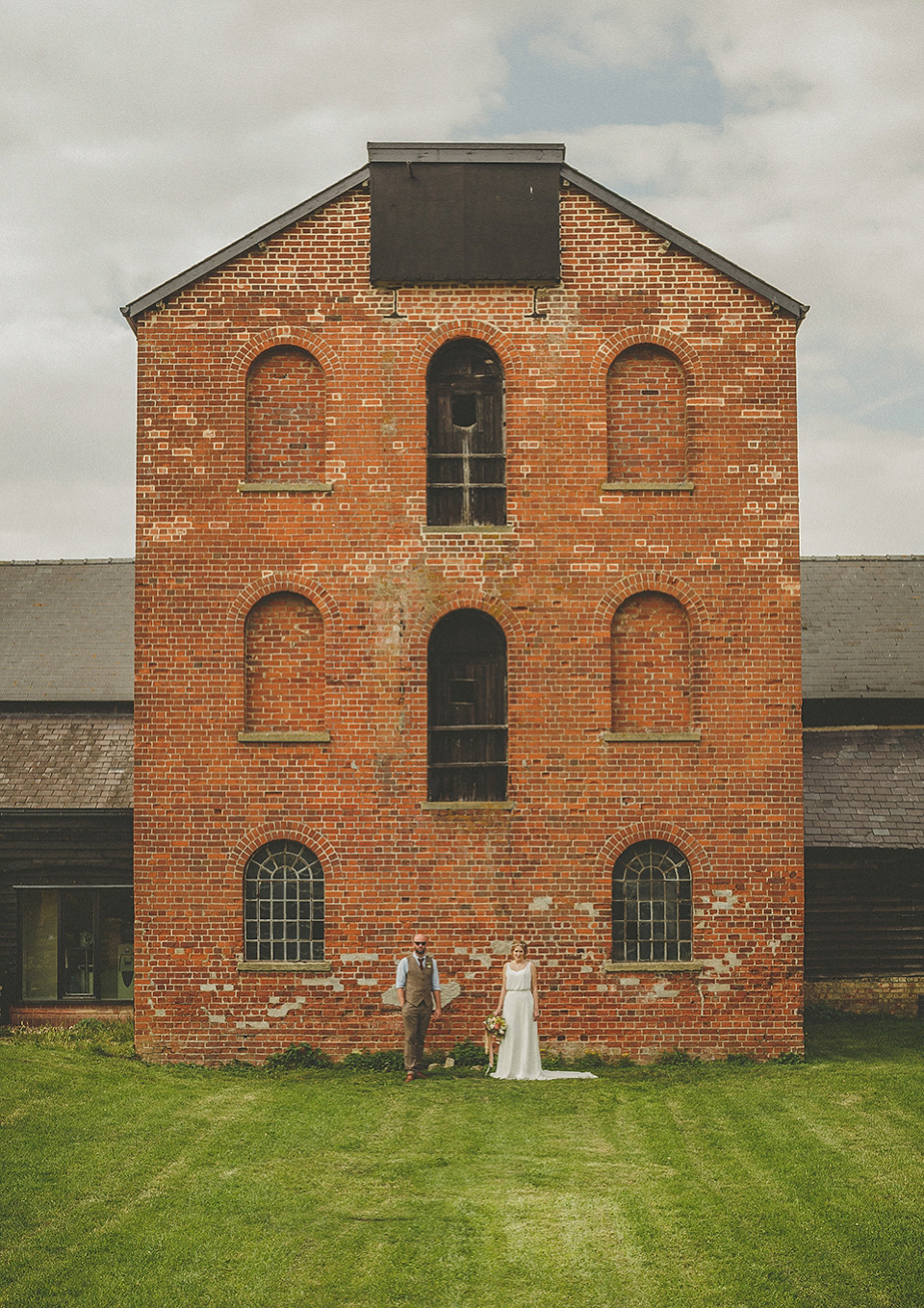 The bride wears an elegant Stephanie Allin gown for her wedding at Childerley in Cambridge. Photography by Howell Jones.