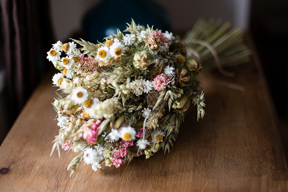 A Rustic Barn Wedding With a Bride in Catherine Deane and a Dried Flower Crown. Photography by Jo Hastings.