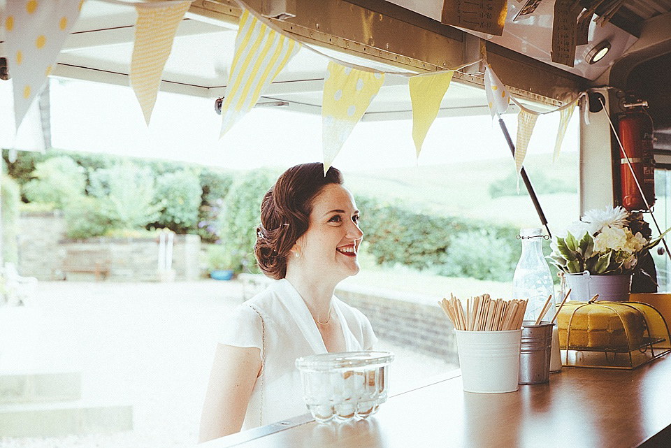 The bride wears a 1950's inspired belted gown by Loulou bridal for her vintage style wedding in North Yorkshire. Photography by Ryan of Shutter Go Click.