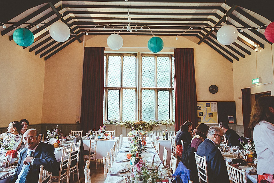 The bride wears a 1950's inspired belted gown by Loulou bridal for her vintage style wedding in North Yorkshire. Photography by Ryan of Shutter Go Click.