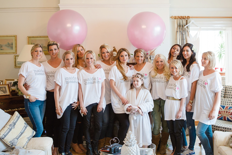 The wedding of Sinclair Seller, co-founder of Maids to Measure. Sinclair had 13 bridesmaids for her laid-back and glamorous British backyard wedding. Photography by Claire Graham and Lucy Davenport.