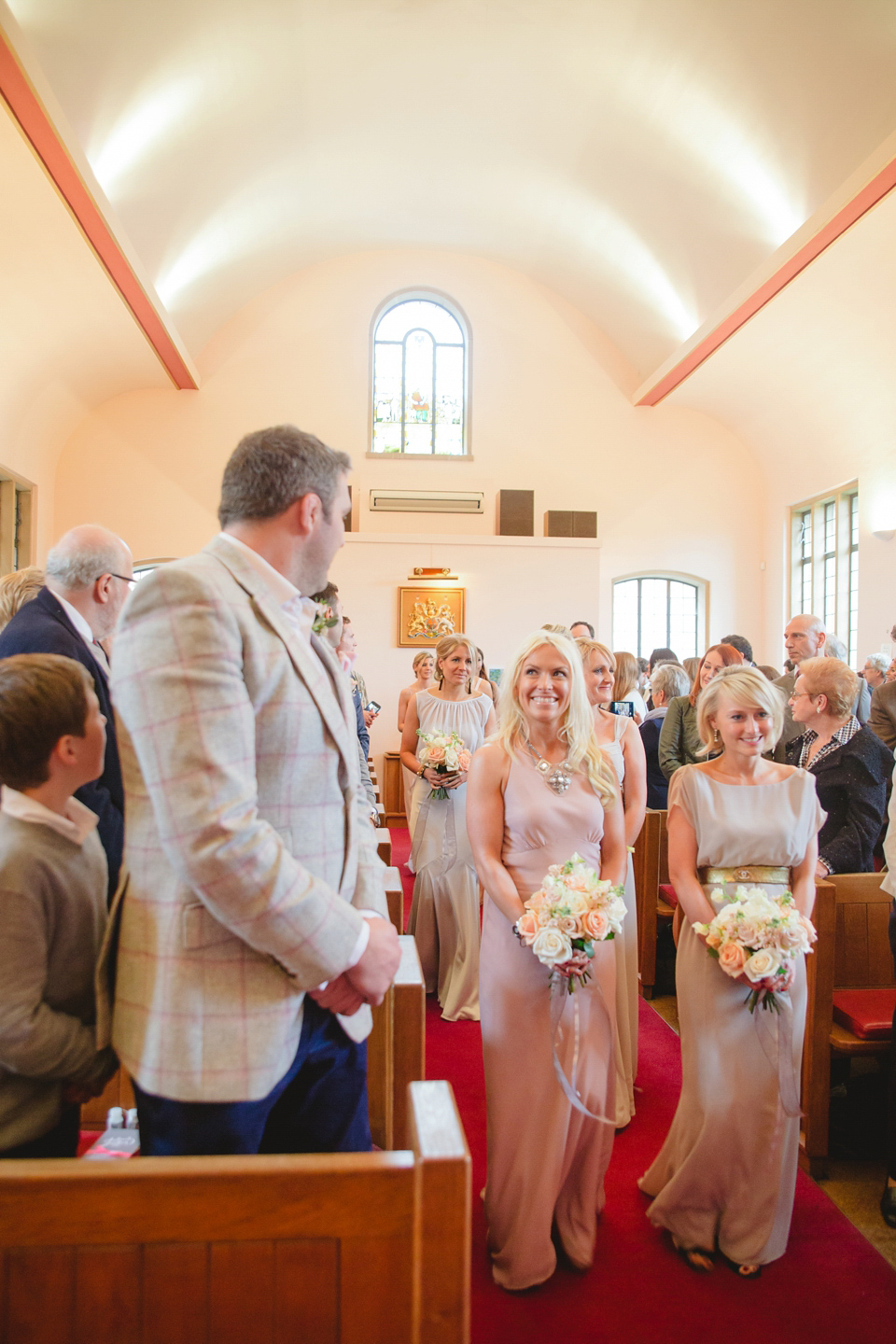 The wedding of Sinclair Seller, co-founder of Maids to Measure. Sinclair had 13 bridesmaids for her laid-back and glamorous British backyard wedding. Photography by Claire Graham and Lucy Davenport.