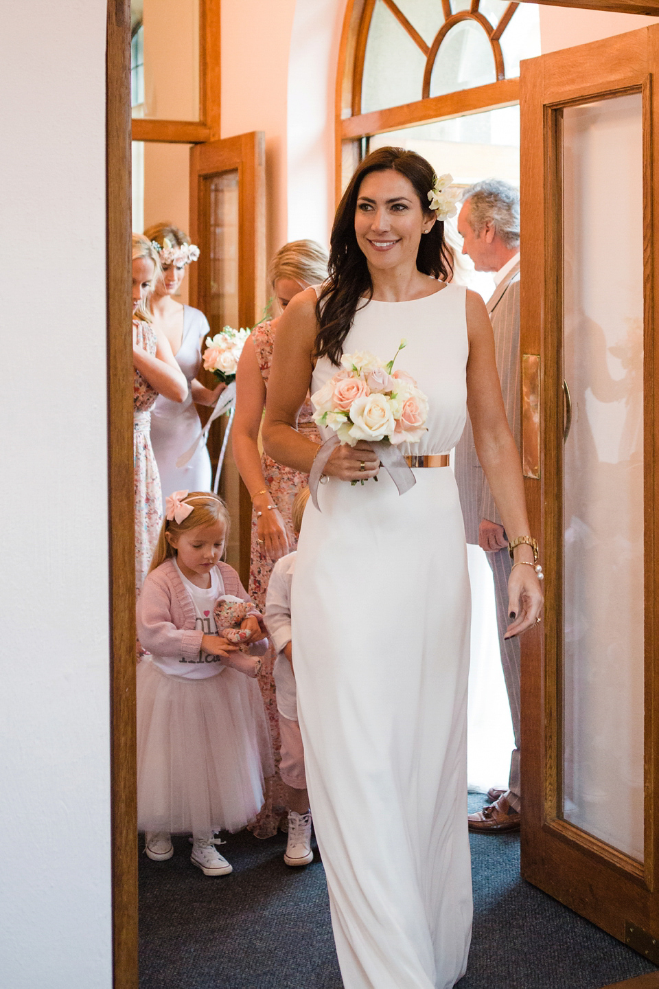 The wedding of Sinclair Seller, co-founder of Maids to Measure. Sinclair had 13 bridesmaids for her laid-back and glamorous British backyard wedding. Photography by Claire Graham and Lucy Davenport.