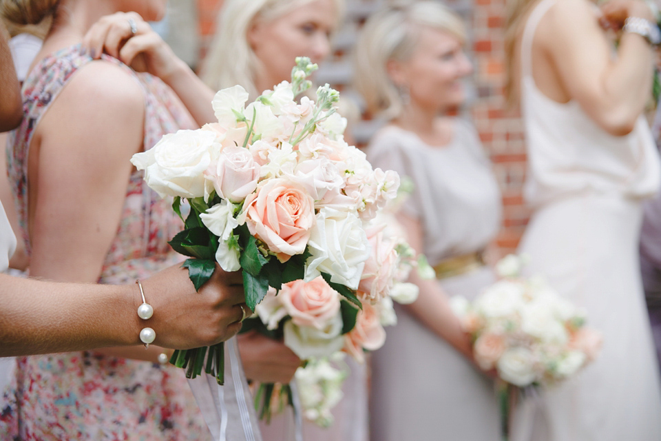 The wedding of Sinclair Seller, co-founder of Maids to Measure. Sinclair had 13 bridesmaids for her laid-back and glamorous British backyard wedding. Photography by Claire Graham and Lucy Davenport.