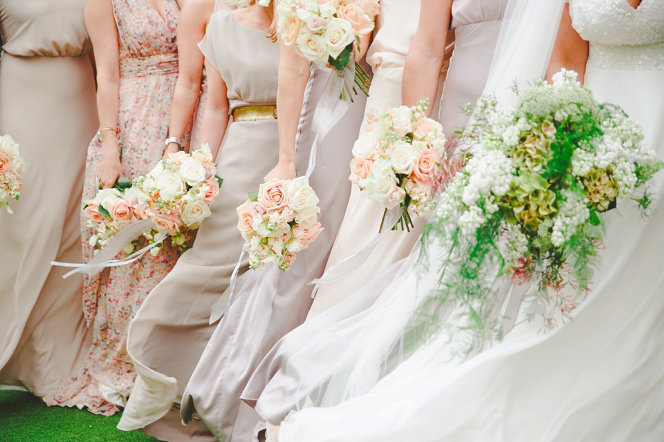 The wedding of Sinclair Seller, co-founder of Maids to Measure. Sinclair had 13 bridesmaids for her laid-back and glamorous British backyard wedding. Photography by Claire Graham and Lucy Davenport.