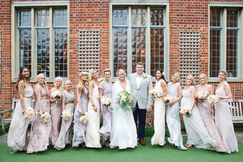 The wedding of Sinclair Seller, co-founder of Maids to Measure. Sinclair had 13 bridesmaids for her laid-back and glamorous British backyard wedding. Photography by Claire Graham and Lucy Davenport.