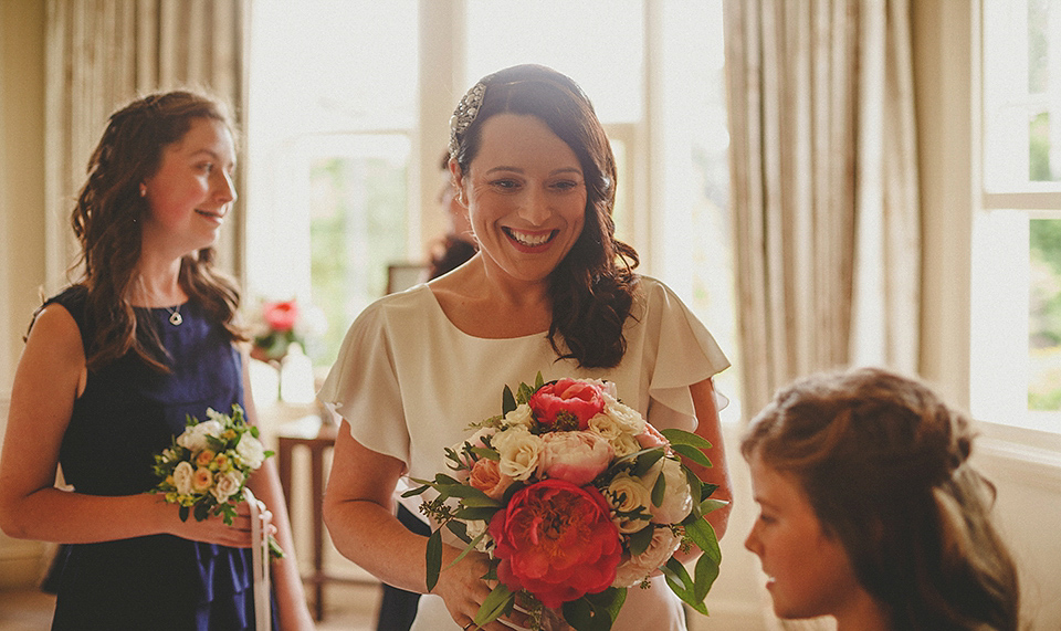 A Backless David Fielden Gown for a Travel Inspired Summer Wedding. Photography by Howell Jones.