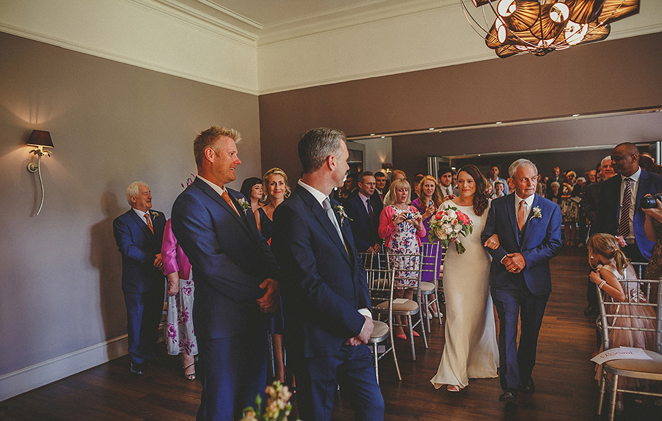 A Backless David Fielden Gown for a Travel Inspired Summer Wedding. Photography by Howell Jones.