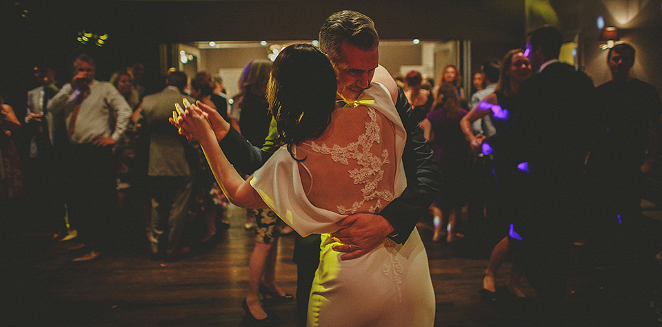 A Backless David Fielden Gown for a Travel Inspired Summer Wedding. Photography by Howell Jones.