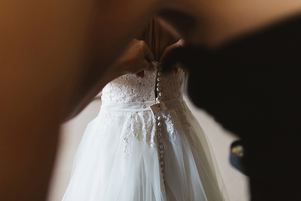 A Tulle Gown and Bridesmaids in Black for an Elegant Travel Inspired Wedding. Photography by Miss Gen.