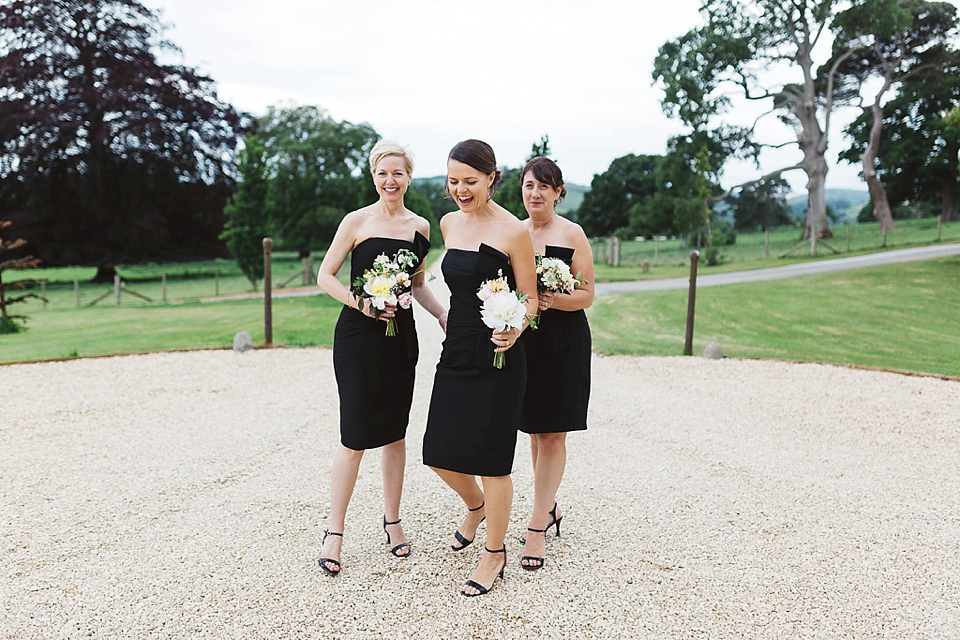 A Tulle Gown and Bridesmaids in Black for an Elegant Travel Inspired Wedding. Photography by Miss Gen.