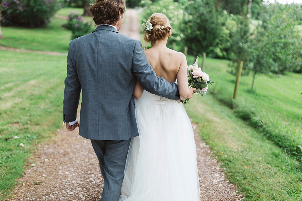 A Tulle Gown and Bridesmaids in Black for an Elegant Travel Inspired Wedding. Photography by Miss Gen.