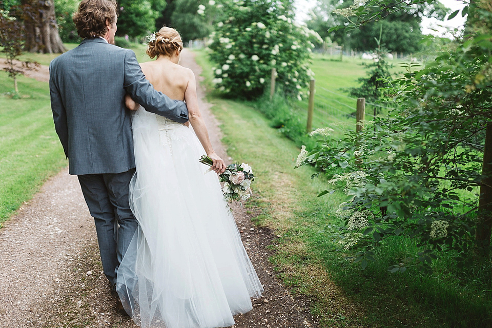 A Tulle Gown and Bridesmaids in Black for an Elegant Travel Inspired Wedding. Photography by Miss Gen.