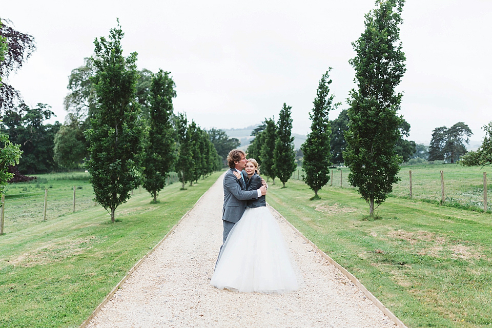 A Tulle Gown and Bridesmaids in Black for an Elegant Travel Inspired Wedding. Photography by Miss Gen.