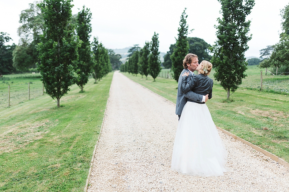 A Tulle Gown and Bridesmaids in Black for an Elegant Travel Inspired Wedding. Photography by Miss Gen.