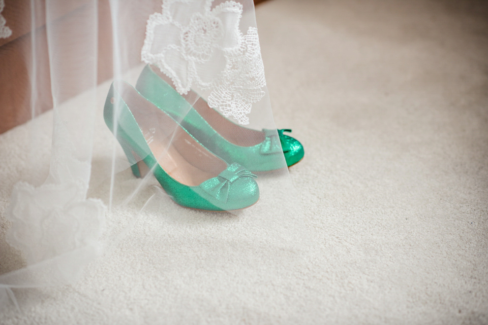 Green wedding shoes and a Jesus Peiro gown for this elegant wedding held at Fetcham Park in Surrey. Photography by Sophie Duckworth.