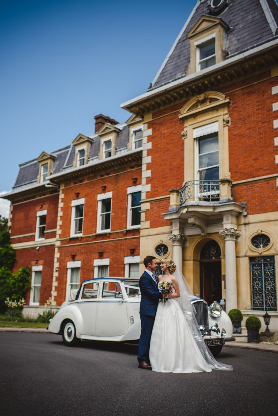 Green wedding shoes and a Jesus Peiro gown for this elegant wedding held at Fetcham Park in Surrey. Photography by Sophie Duckworth.