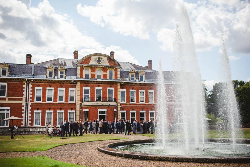 Green wedding shoes and a Jesus Peiro gown for this elegant wedding held at Fetcham Park in Surrey. Photography by Sophie Duckworth.